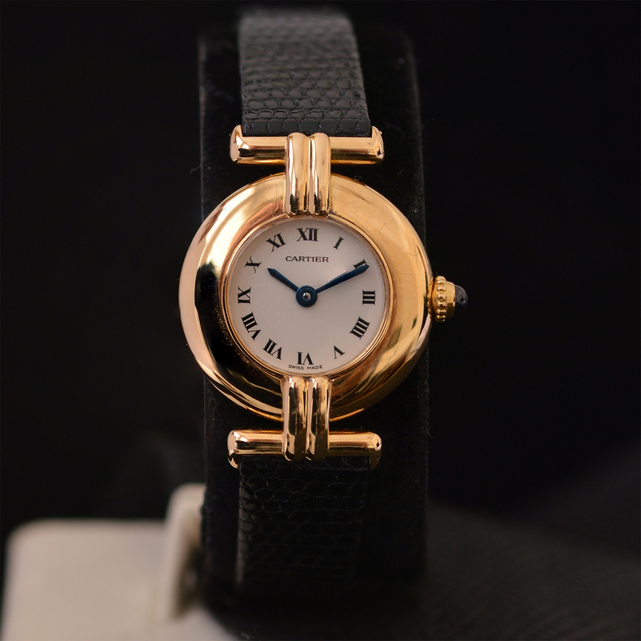 black and gold cartier watch