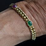 queen-maxima-bracelet-carl-bucherer-18k-gold-curb-link-bracelet-sapphire-ruby-emerald