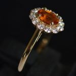 oval-spessartine-mandarin-garnet-halo-ring-yellow-gold-round-conflict-free-diamonds-cluster-engagement-lady-di