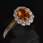 oval-spessartine-mandarin-garnet-halo-ring-yellow-gold-round-conflict-free-diamonds-cluster-engagement-lady-di