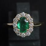 entourage-ring-yellow-gold-oval-emerald-round-conflict-free-diamonds-cluster-engagement-lady-di