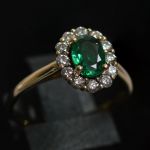 entourage-ring-yellow-gold-oval-emerald-round-conflict-free-diamonds-cluster-engagement-lady-di