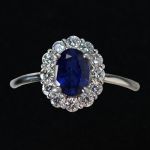 cluster-ring-white-gold-oval-sapphire-round-conflict-free-diamonds-cluster-engagement-lady-di
