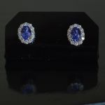 entourage-earrings-white-gold-oval-tanzanite-round-conflict-free-diamonds-cluster-lady-di