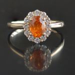 oval-spessartine-mandarin-garnet-halo-ring-yellow-gold-round-conflict-free-diamonds-cluster-engagement-lady-di