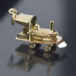 antique-gold-train-locomotive-charm